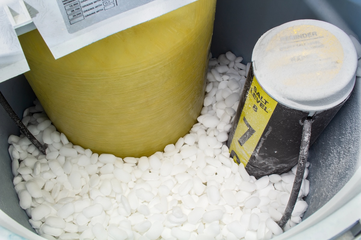 Water softener filled with salt tablets.