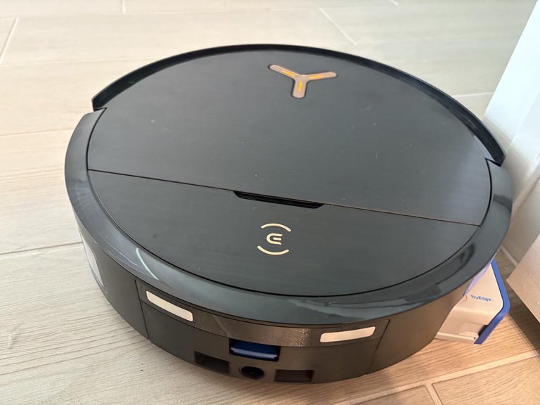 EcoVacs Deebot x9 omni Pro roller popout while the vacuum cleans a wood-look floor