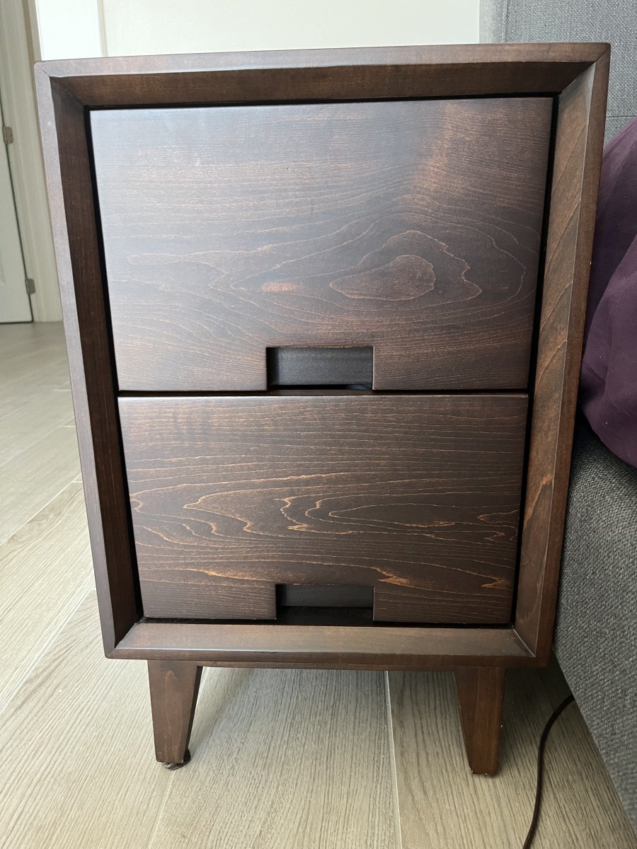 Closeup of skinny dark brown wood nightstand