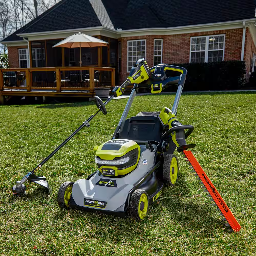 A collection of electric RYOBI outdoor tools.