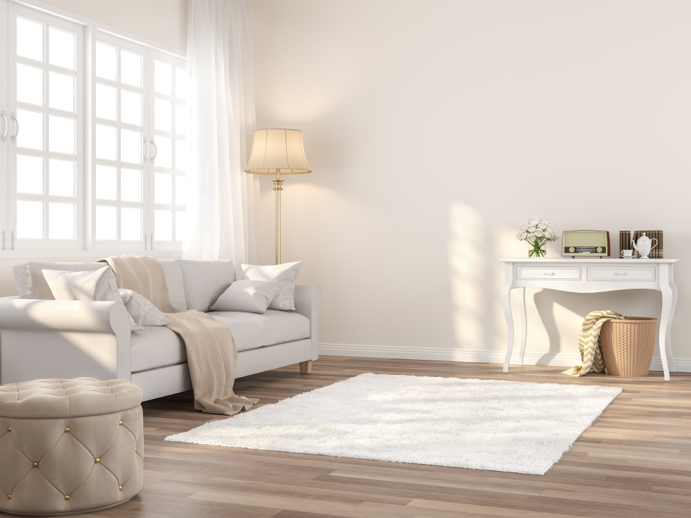 Living room designed with light neutral colors including the cream wall.