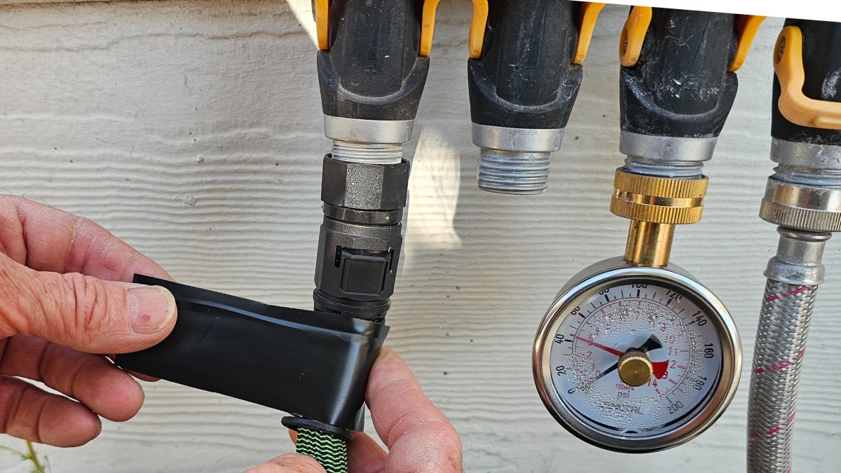 Applying Flex Tape to a leaking hose