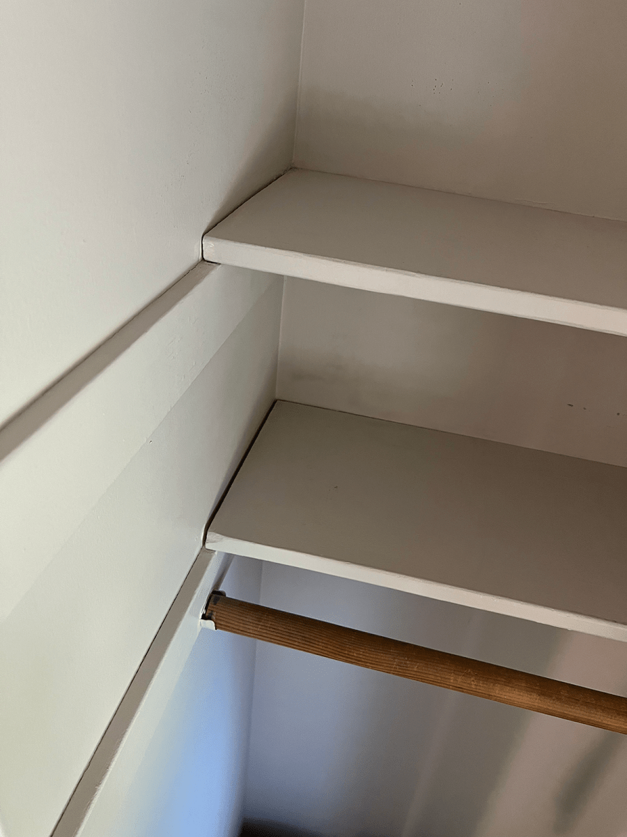 DIY closet shelves installed in a closet.