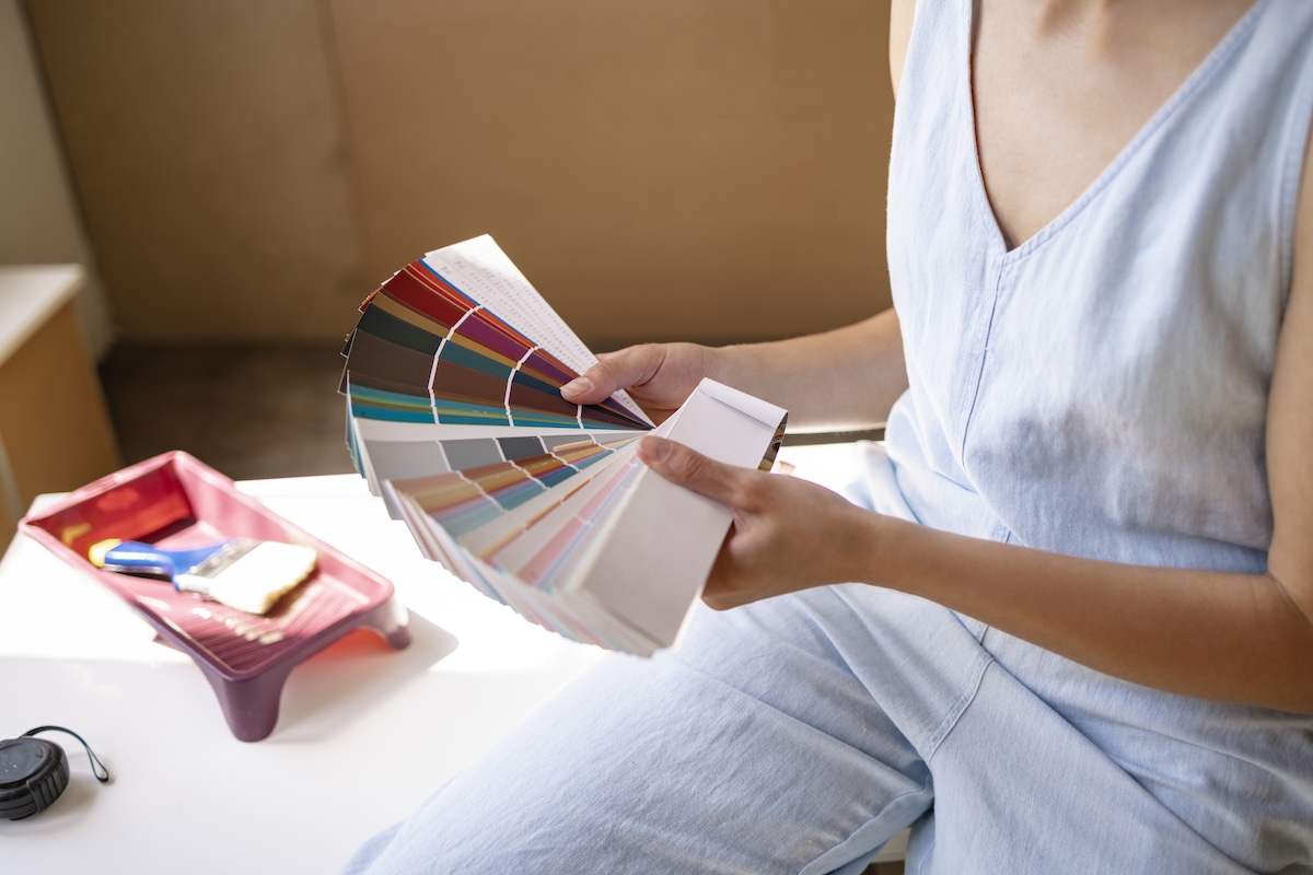 A DIYer choosing a trendy paint color for a 2026 refresh.