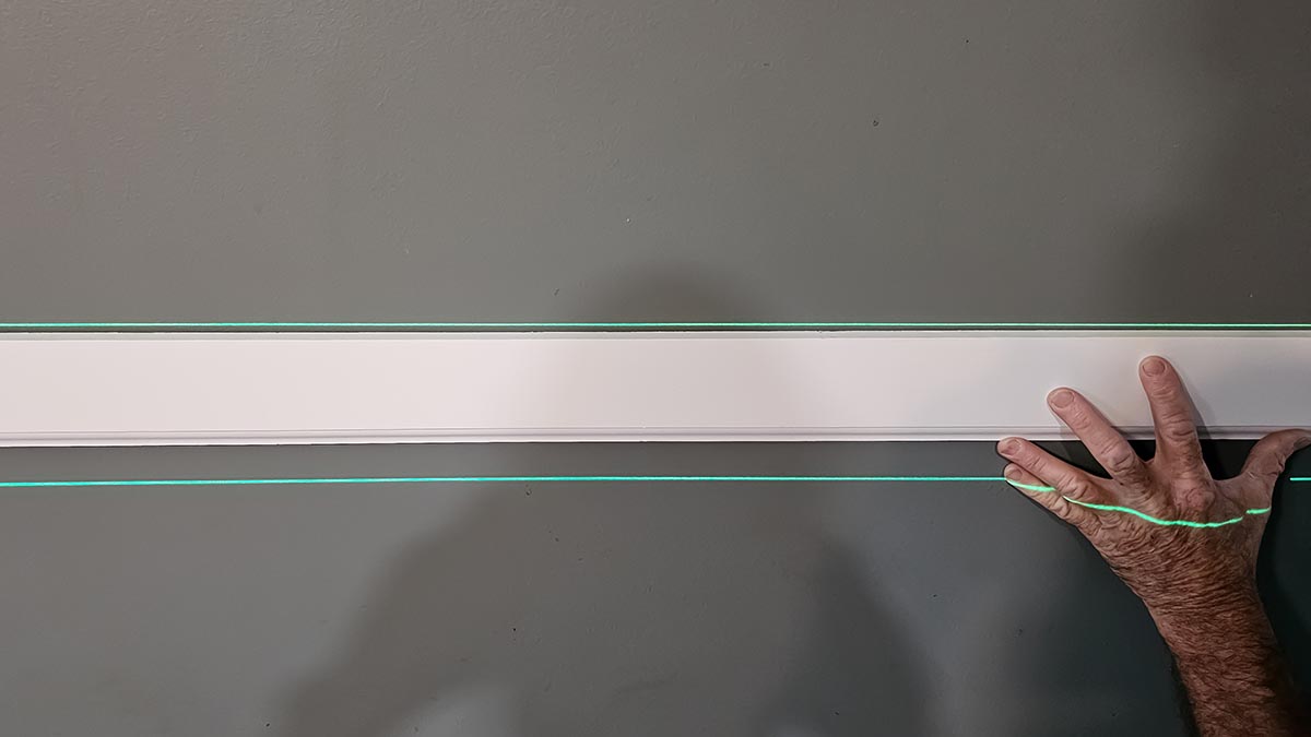 Heuper Laser Level creating lines for installing molding