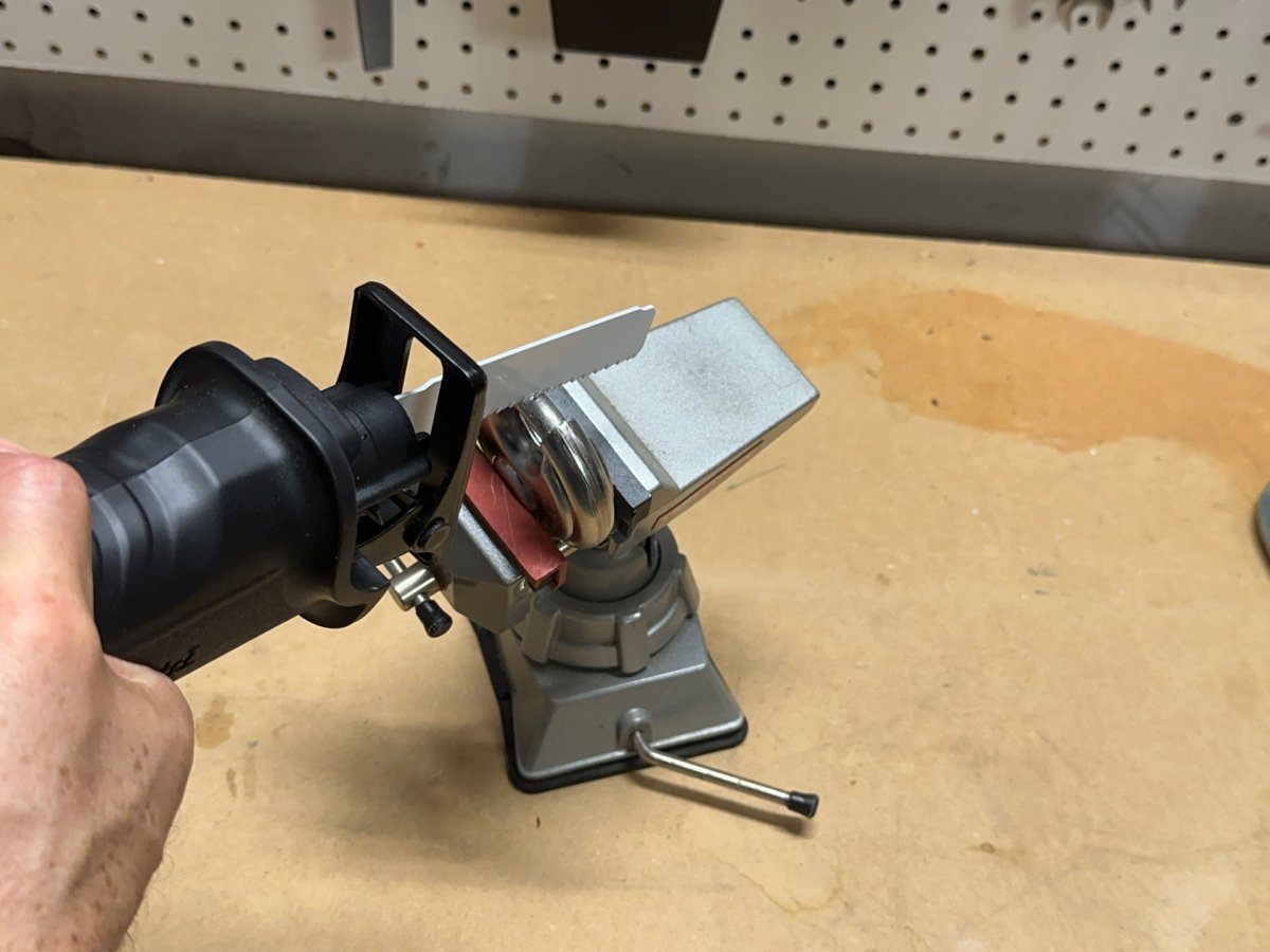 A person trying to open a padlock