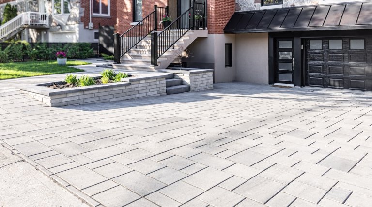 A driveway featuring large gray pavers.