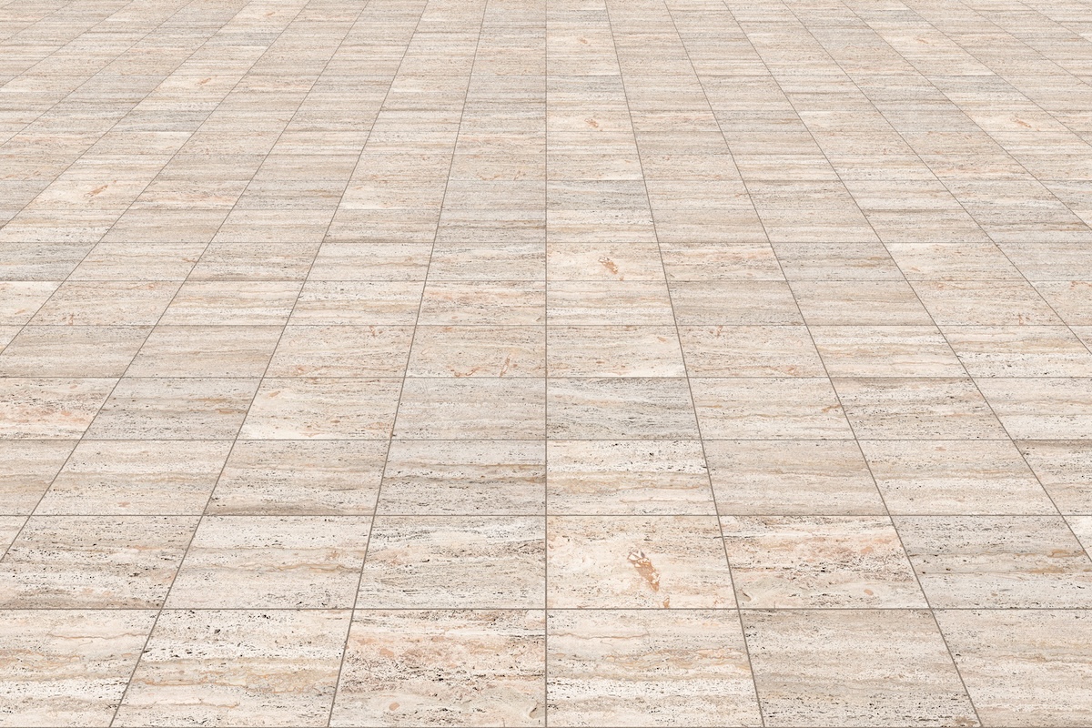 Travertine pavers on a driveway.