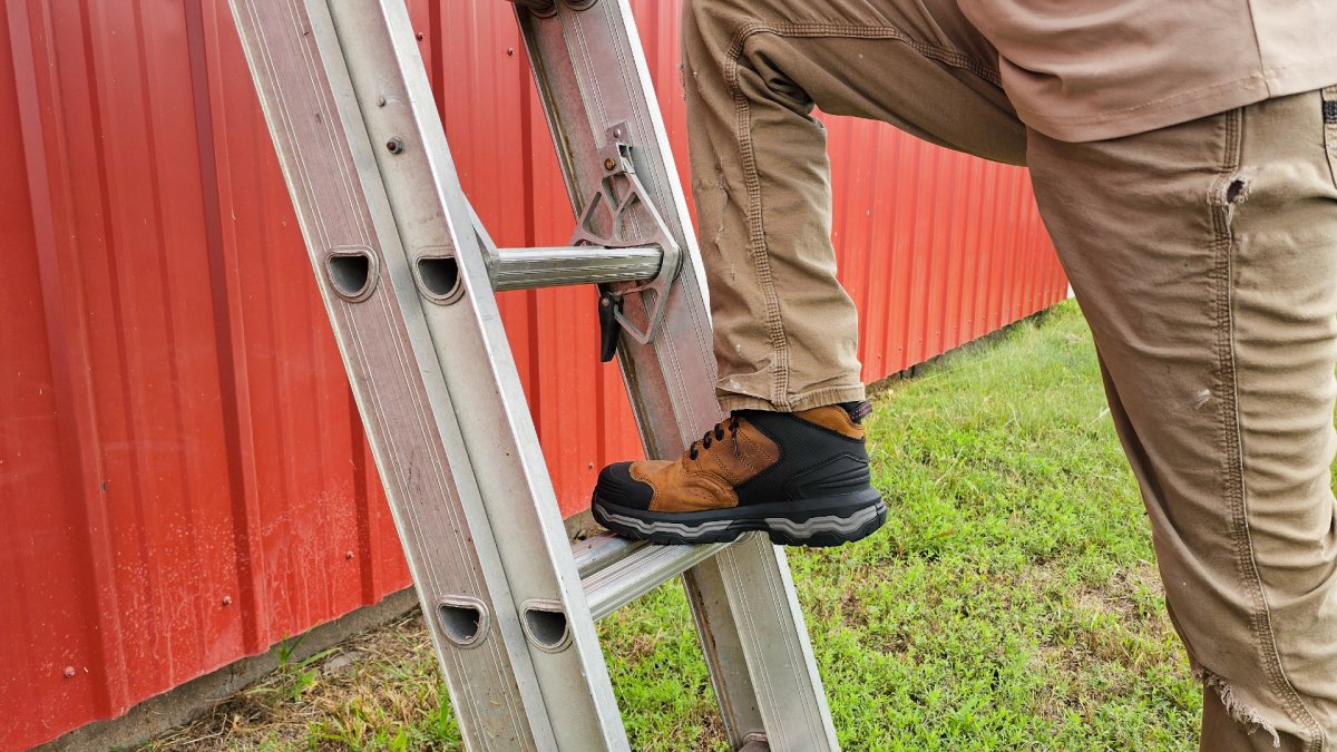 Climbing a ladder with Wolverine Alpha Boots