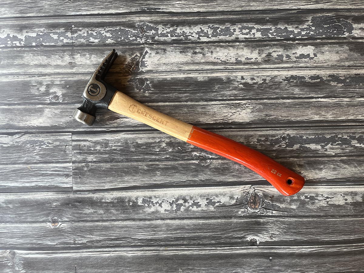 Crescent framing hammer on gray, aged deck boards