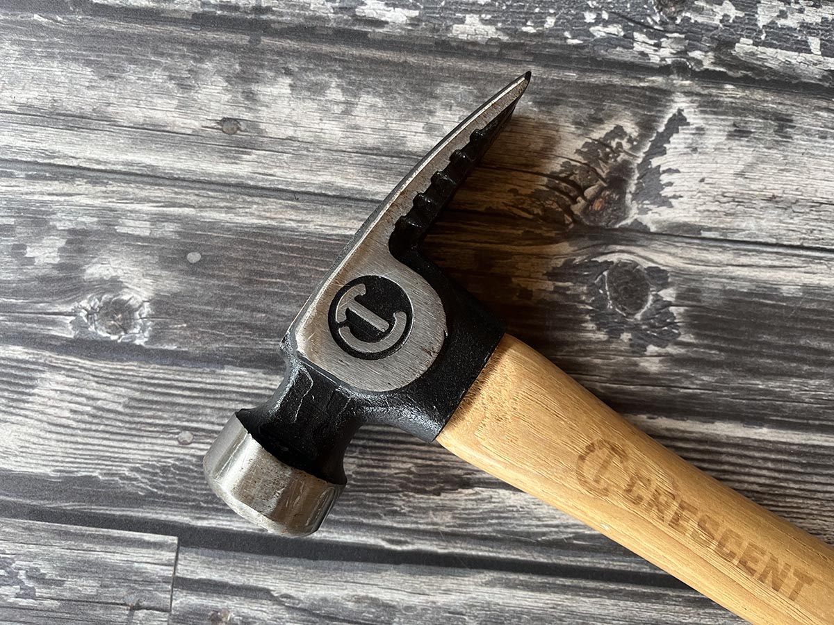 Crescent framing hammer head