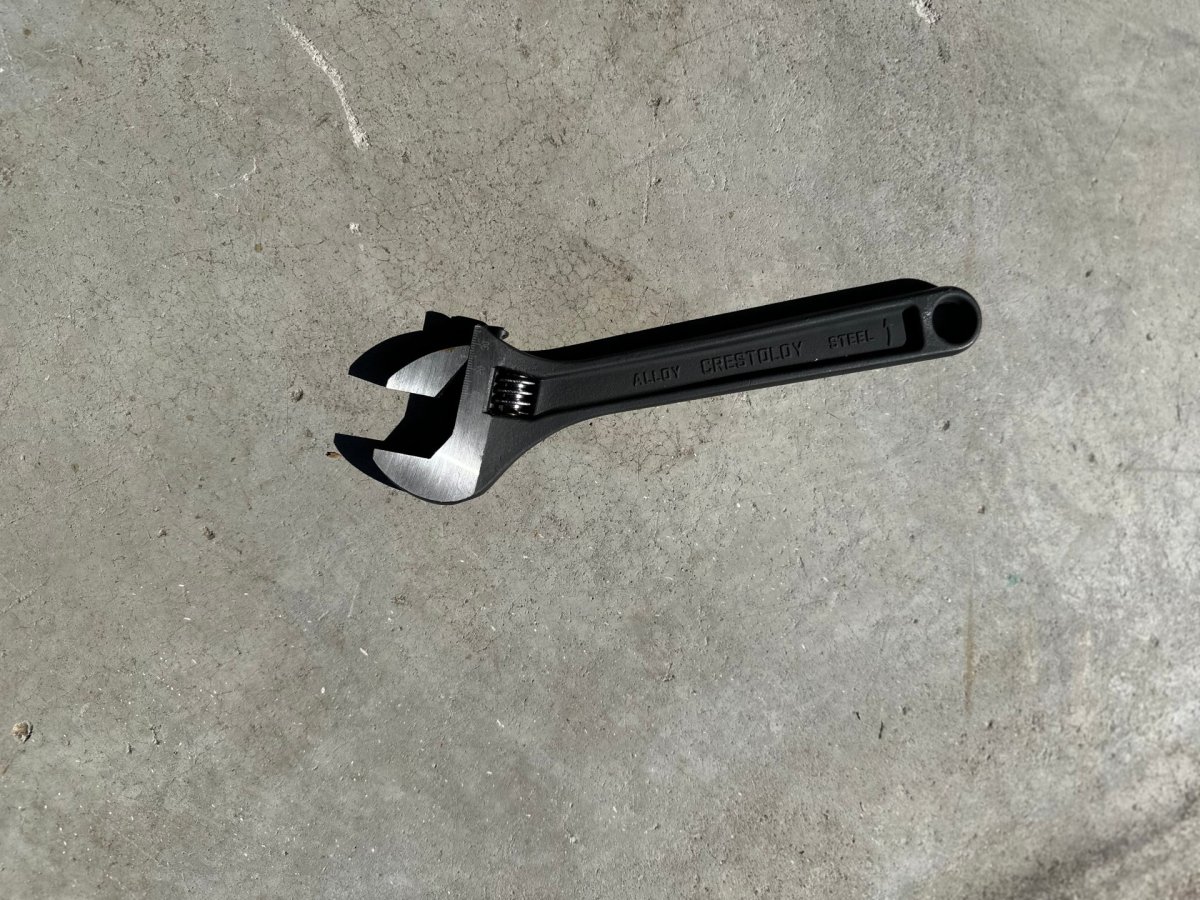 Crescent wrench on concrete slab