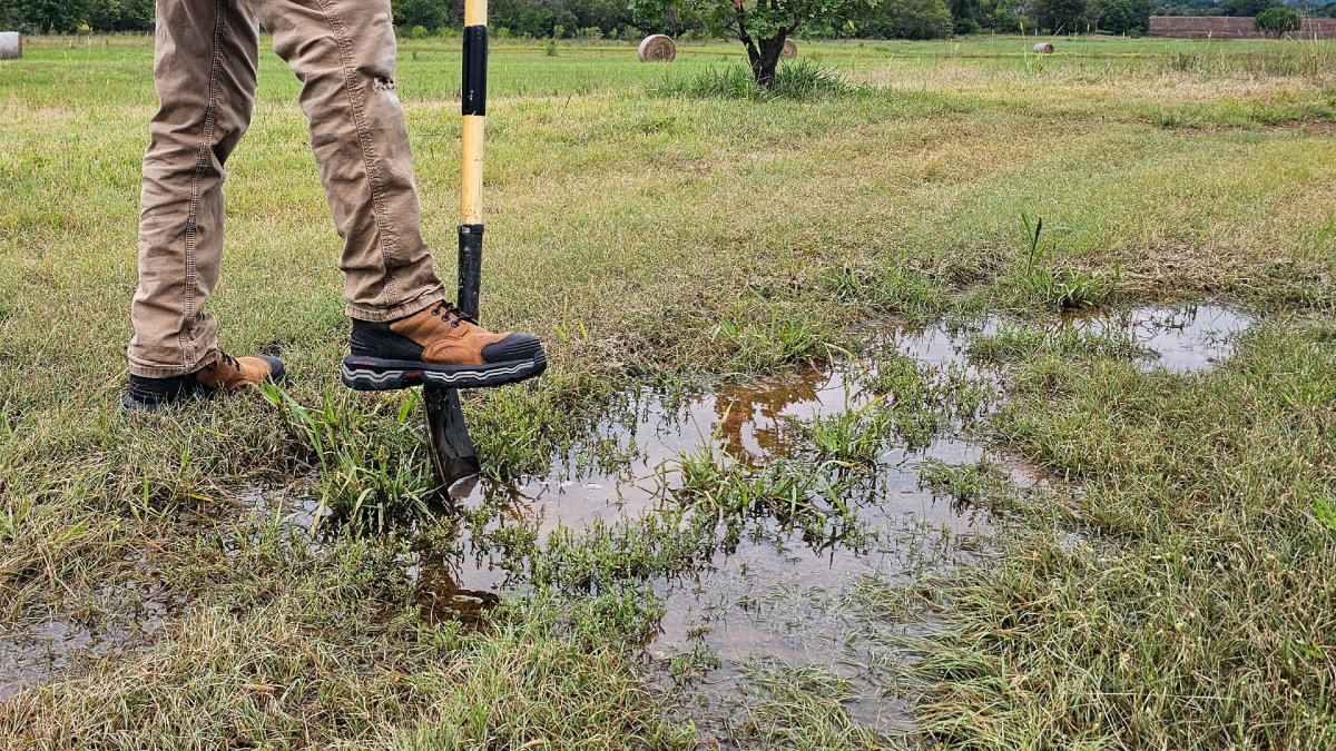 Diggin in muddy area with Wolverine Alpha Boots