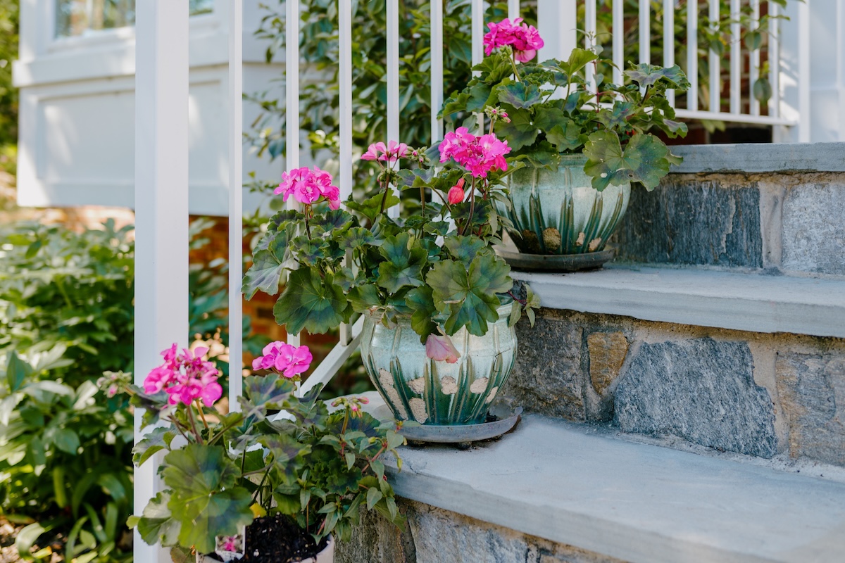 Flower pots on a front stoop for curb appeal in the fall.