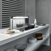 A hidden range hood on a kitchen counter with cooktop.