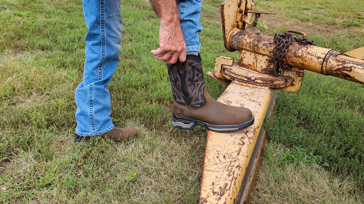 Pulling on wolverine Rancher boots