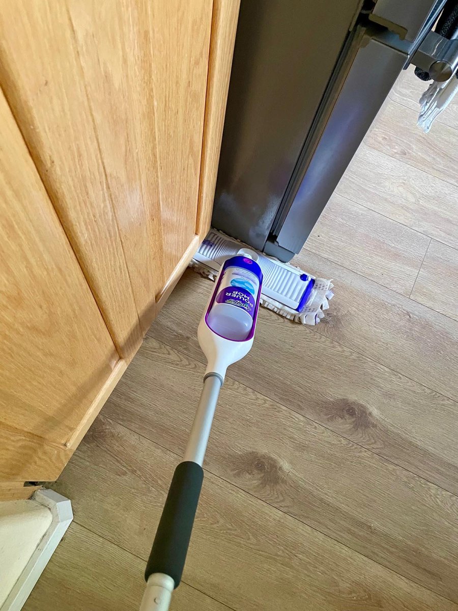 Swiffer PowerMop against baseboard