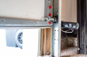 A photo sensor attached to a garage door flashes a light as the door opens.