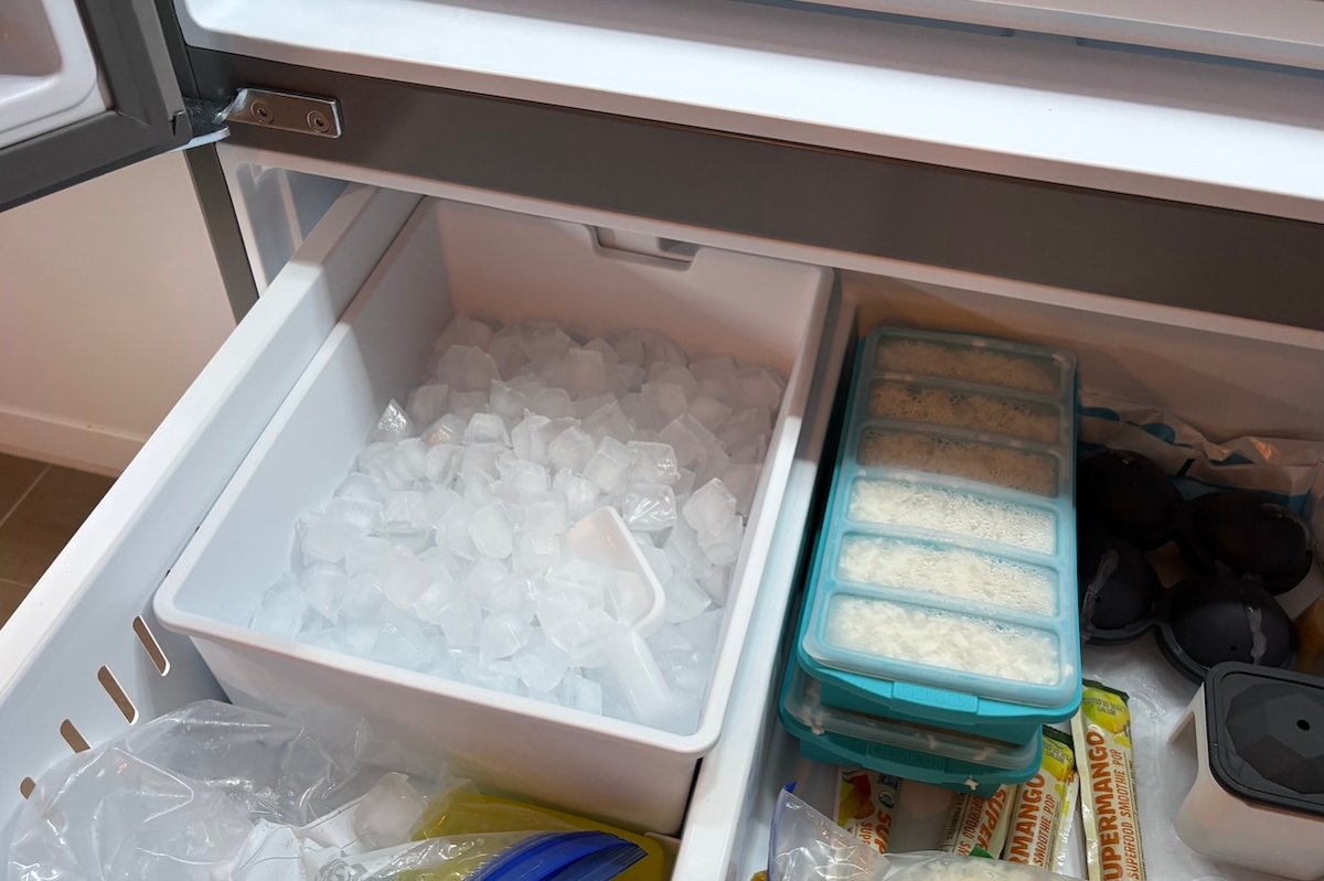 Ice tray full of ice in a bottom freezer of a French door refrigerator.