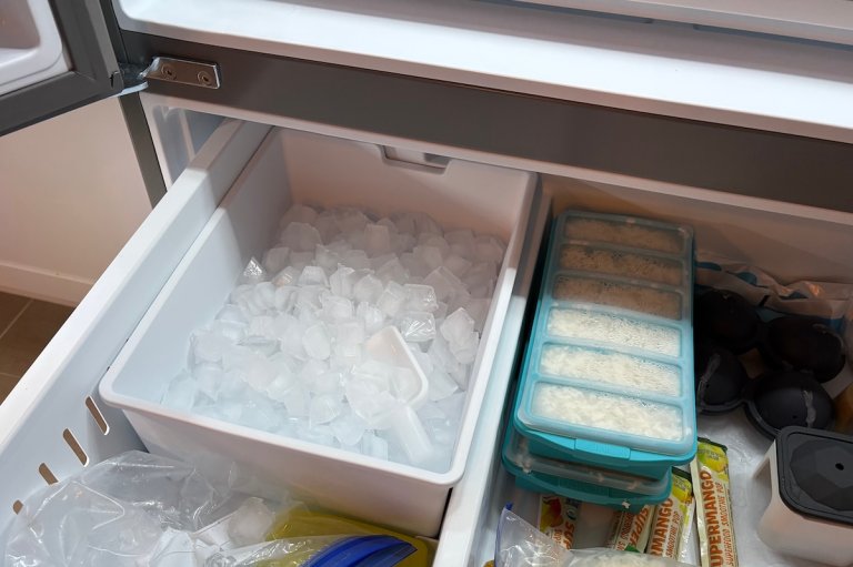 Ice tray full of ice in a bottom freezer of a French door refrigerator.