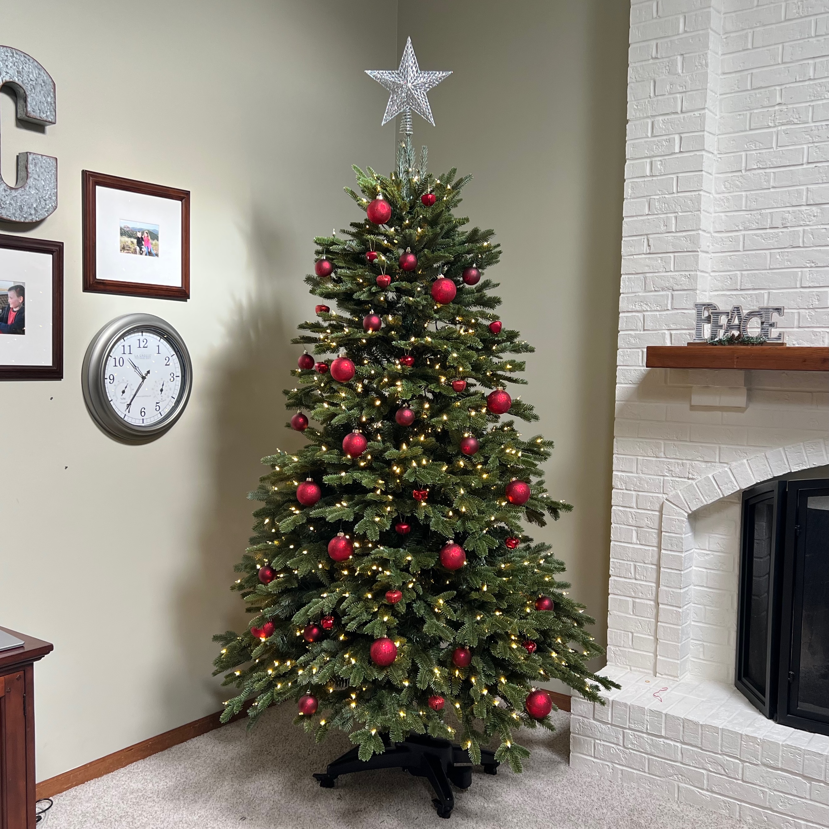 Balsam hill fraser fir flip tree in living room with red ornaments