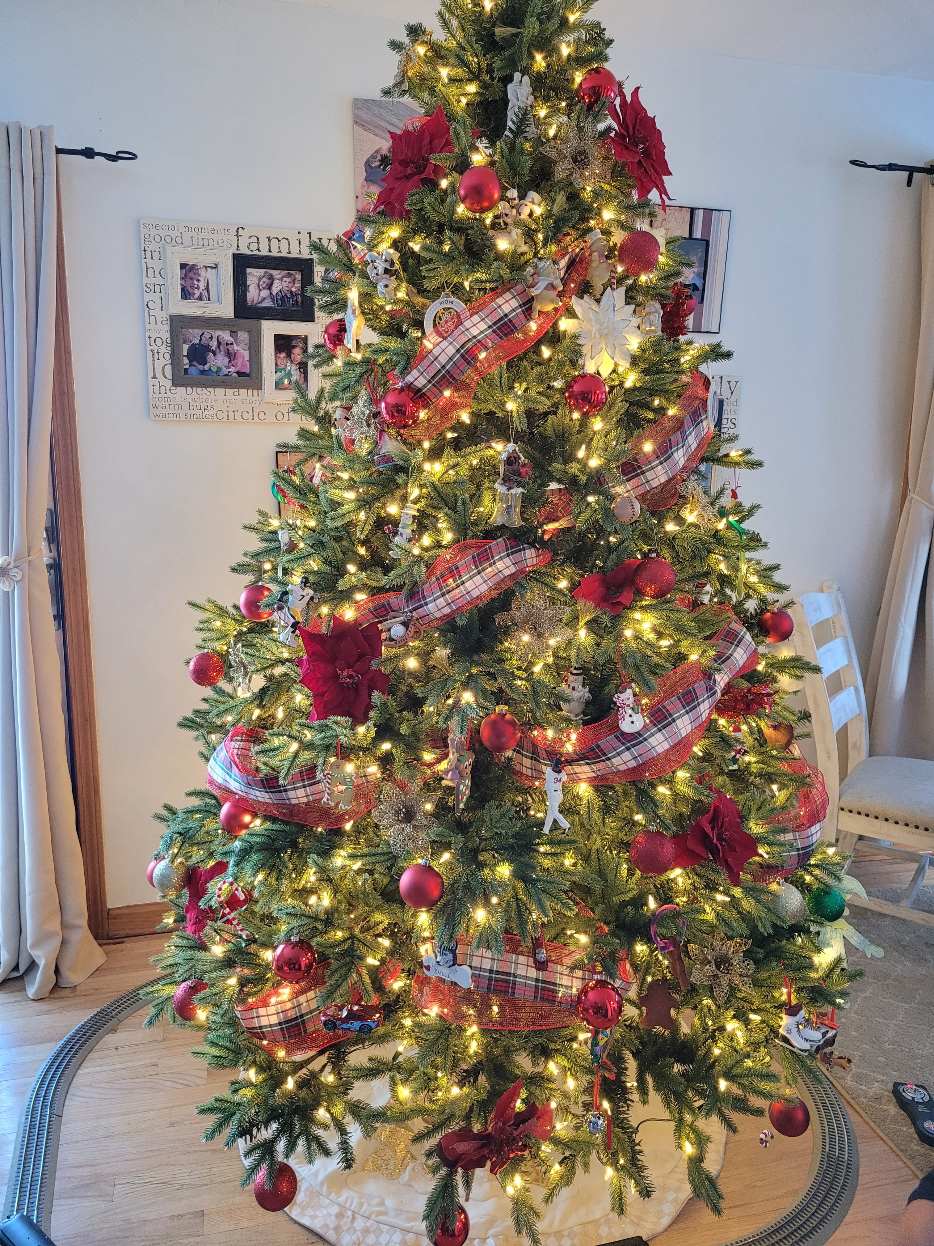 Christmas tree decorated with red plaid ribbon