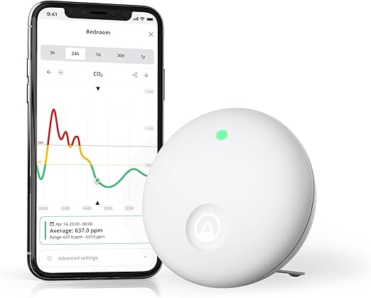 Airthings 322 Wave Enhance and a smartphone on a white background