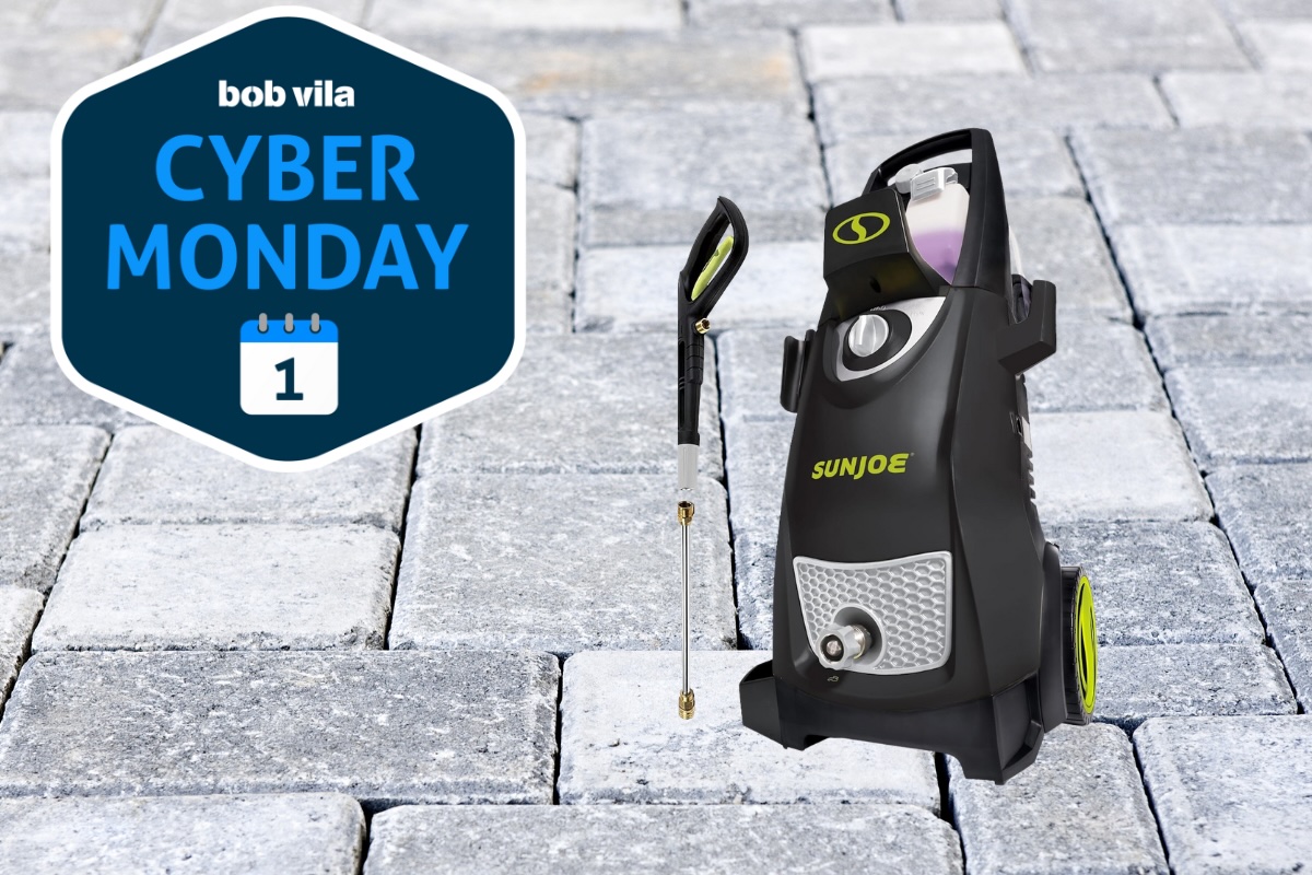 Sun Joe pressure washer on a stone patio background.