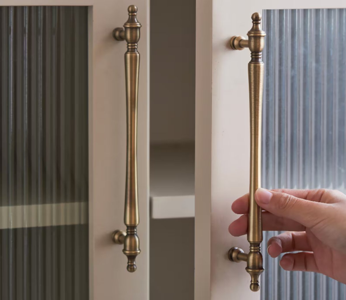 A cabinet door with Classic Antique Brass Handles from the Etsy shop TheBrassArtisan