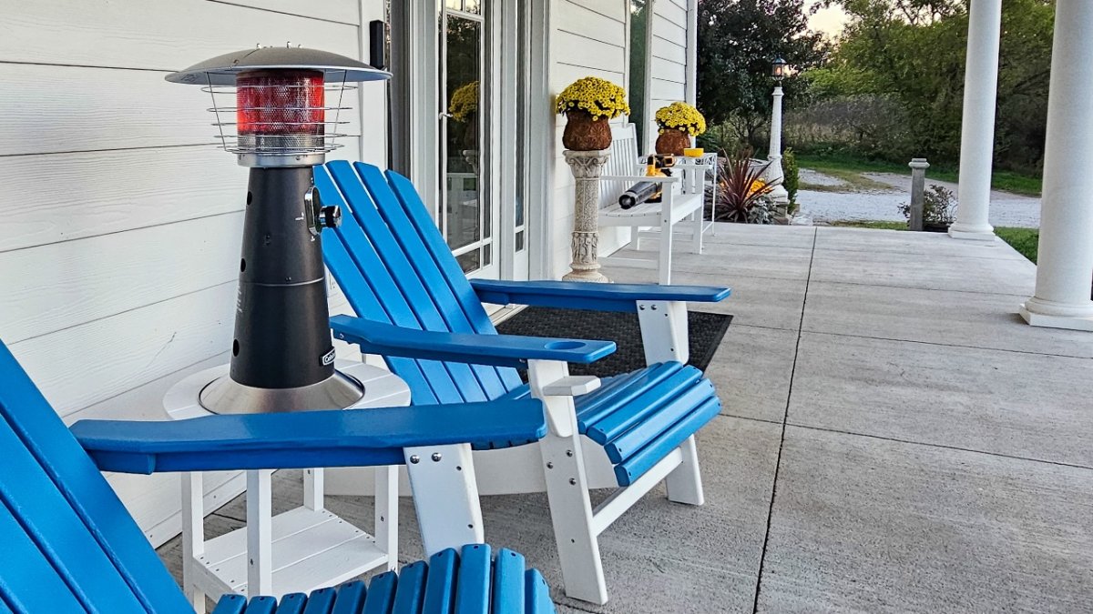 Cuisinart Tabletop patio heater on table between chairs