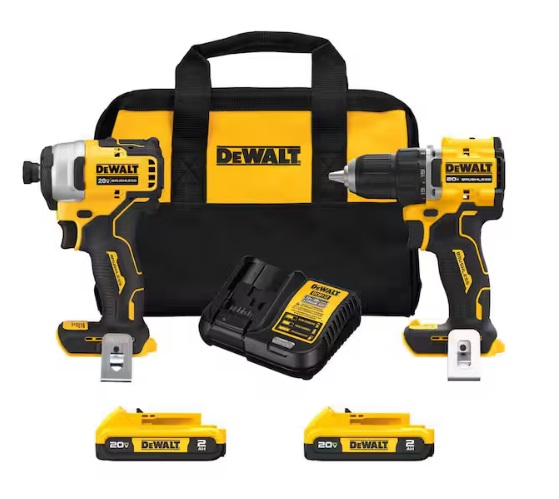 Two DeWalt drills, batteries and a charger on a white background