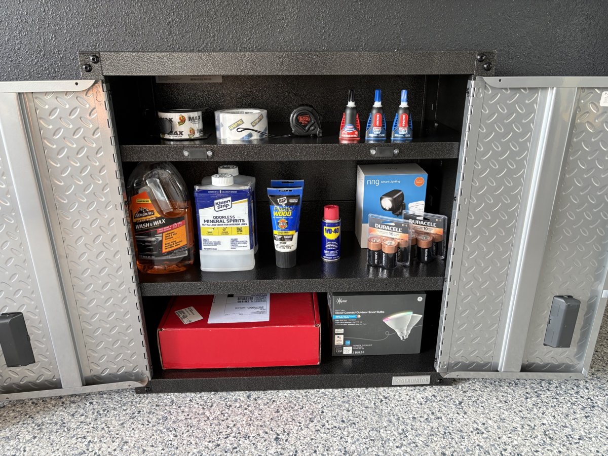 Gladiator garage cabinet open and full