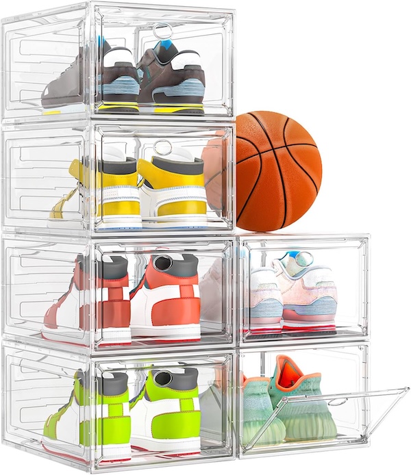 Clear plastic shoe organizers stacked with sneakers inside and a basketball resting on top.