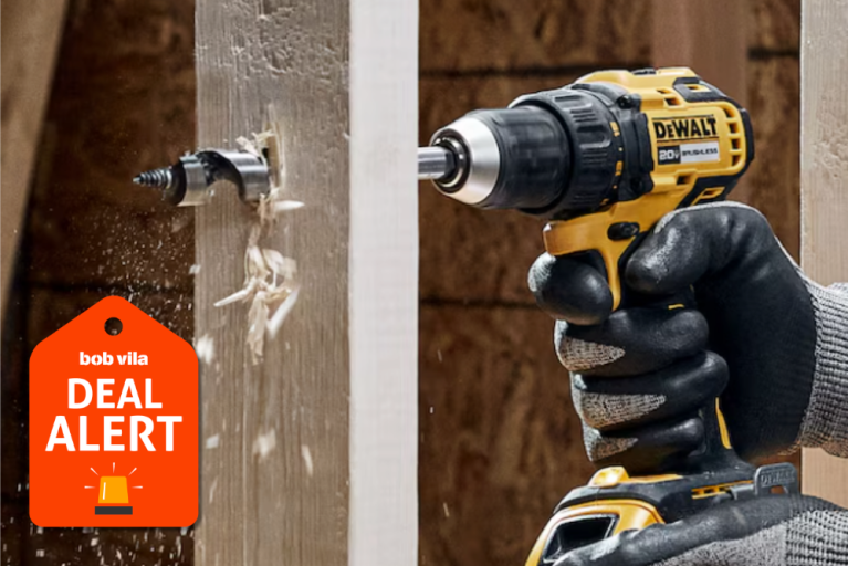 Person drilling though a 2x4