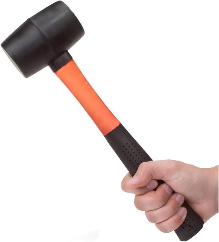 A hand holding the Edward Tools Ergonomic Grip Rubber Mallet Hammer on a white background
