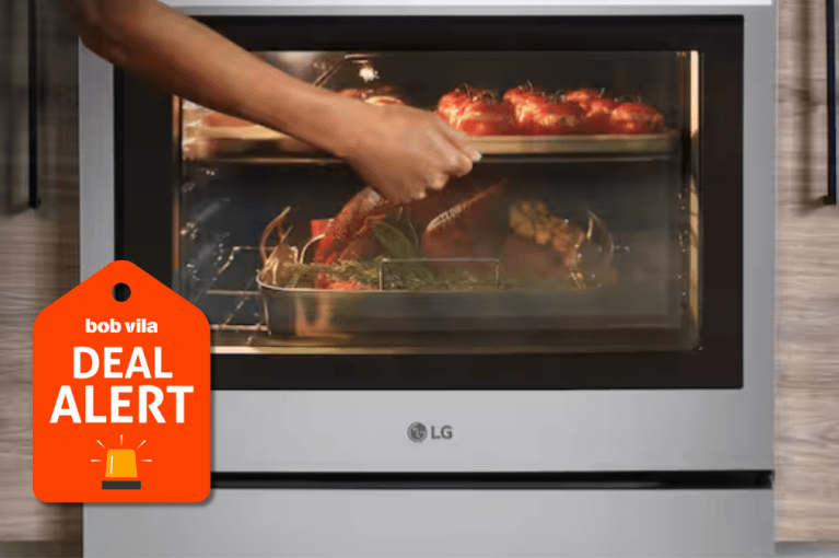 Person opening door to get food out of LG oven