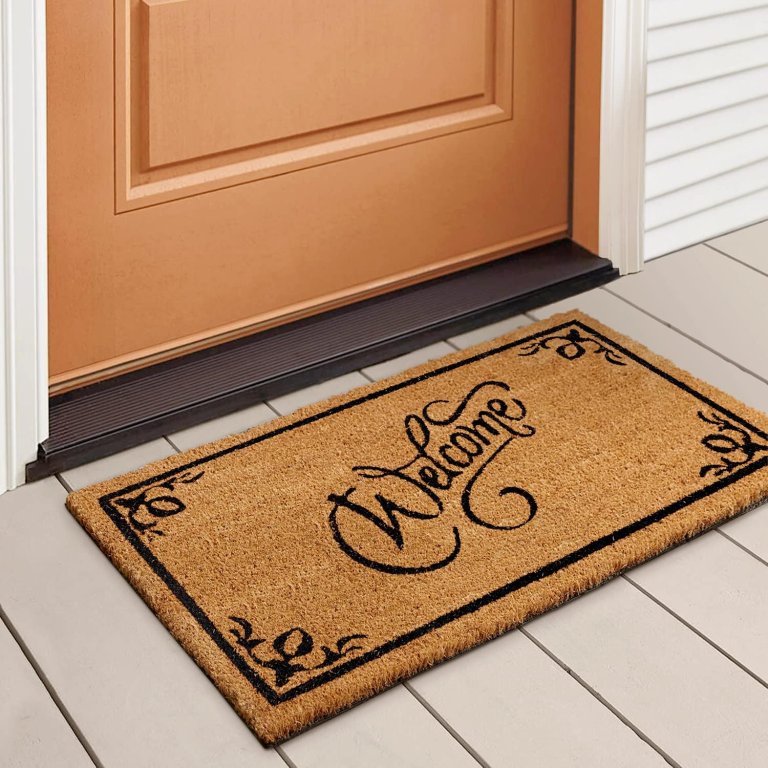 LuxUrux Coco Coir Welcome Mat on a deck in front of a door