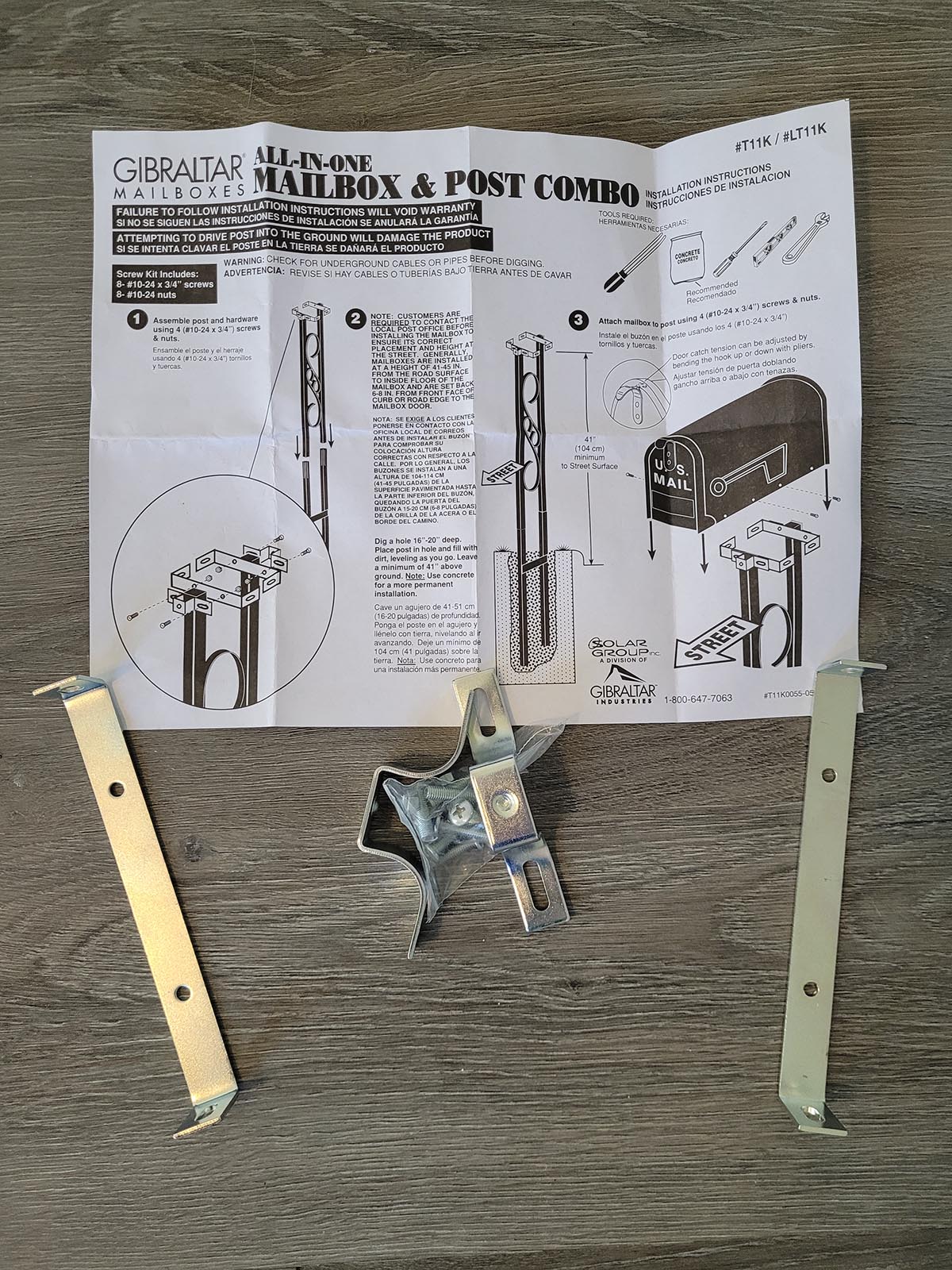 Mailbox to Go Post Kit instructions and required tools lying on a table.
