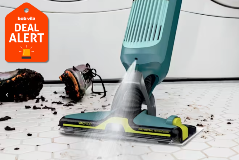 Shark vacmop cleaning up dirt from athletic cleats on laminate floor