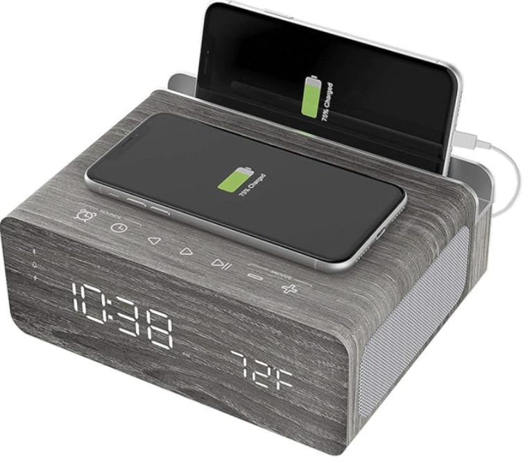 Ion Charge Time Plus Alarm Clock Speaker with Wireless Charging Pad - Gray (Renewed) with phone in charger on white background