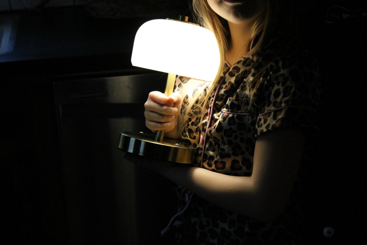 child carrying oneach porrtable lamp