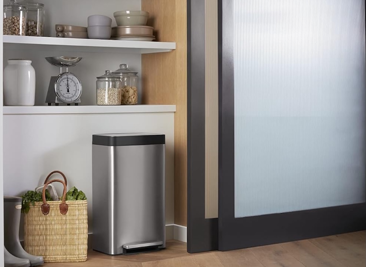 Kohler 8-gallon trash can in a modern-looking, minimalist kitchen.