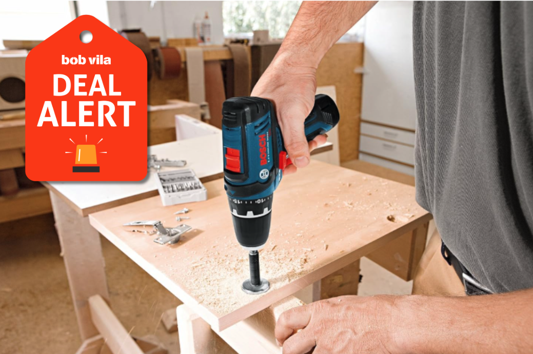 person using bosch driver to construct table