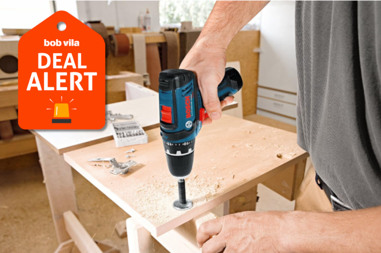 person using bosch driver to construct table