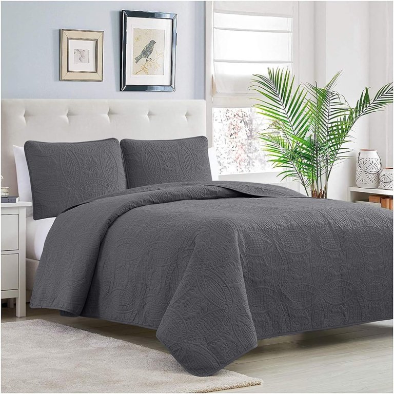Mellanni covelet and shams, a dark grey king-sized coverlet and shams on a bed in a lgiht blue bedroom.