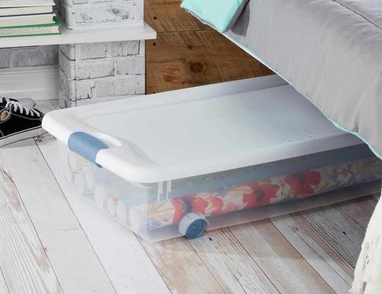 Sterilite underbed plastic storage under the bed with rolls of wrapping paper inside