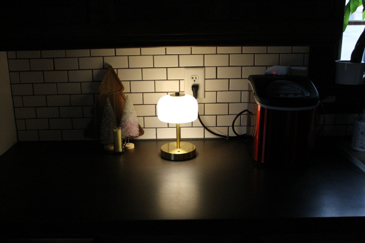 wide shot of oneach portable lamp sitting on kitchen counter