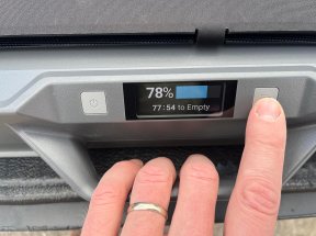 Person pressing button on 4Patriots AlphaCase generator