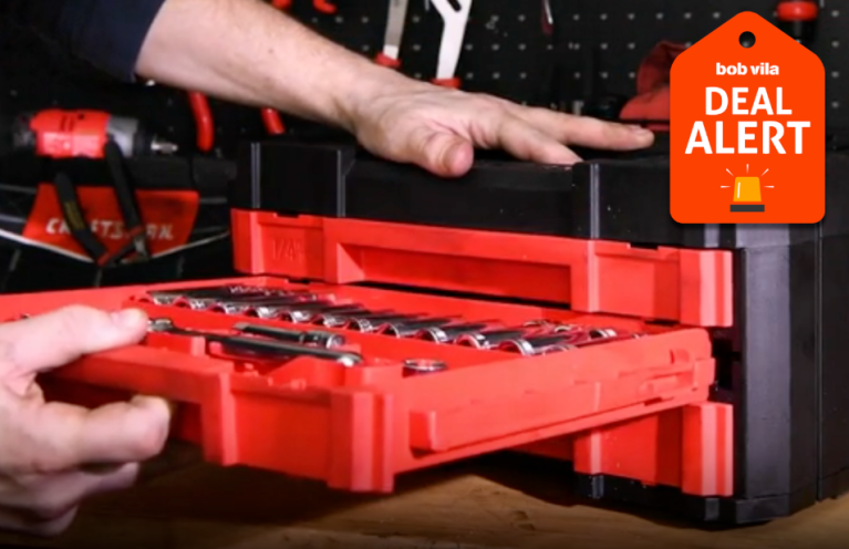 Person pulling drawer from tool chest.