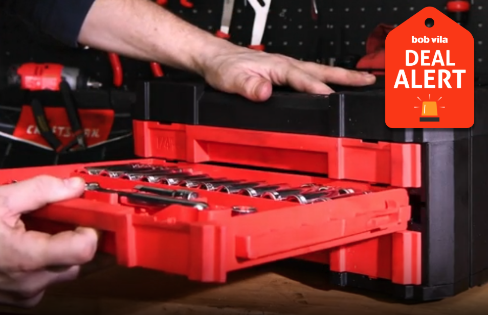Person pulling drawer from tool chest.